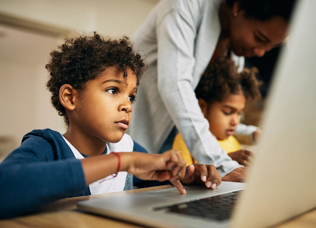 boy-focusing-on-computer boy-focusing-on-computer