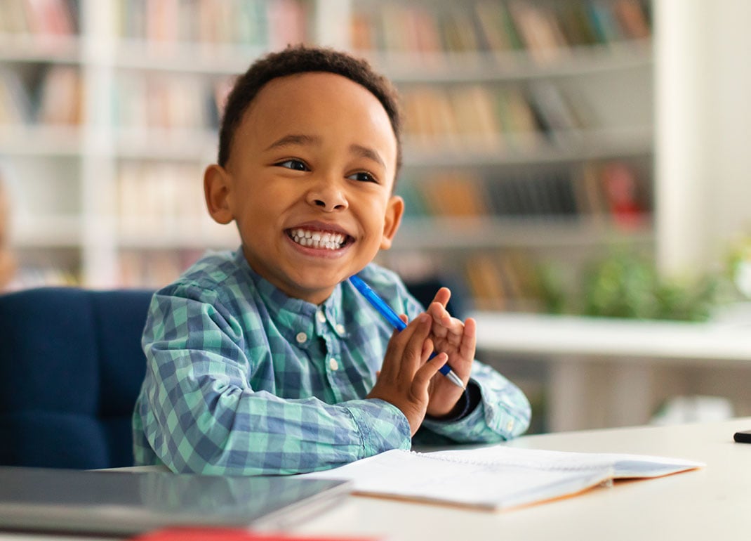 cheerful-boy-in-classroom cheerful-boy-in-classroom