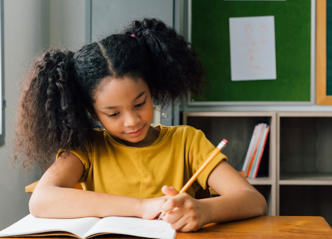 child-writing-in-book child-writing-in-book