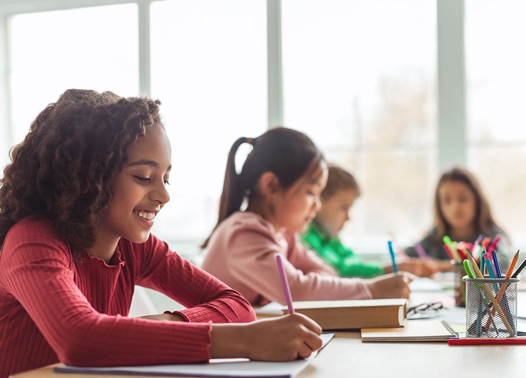 small-group-students-writing small-group-students-writing