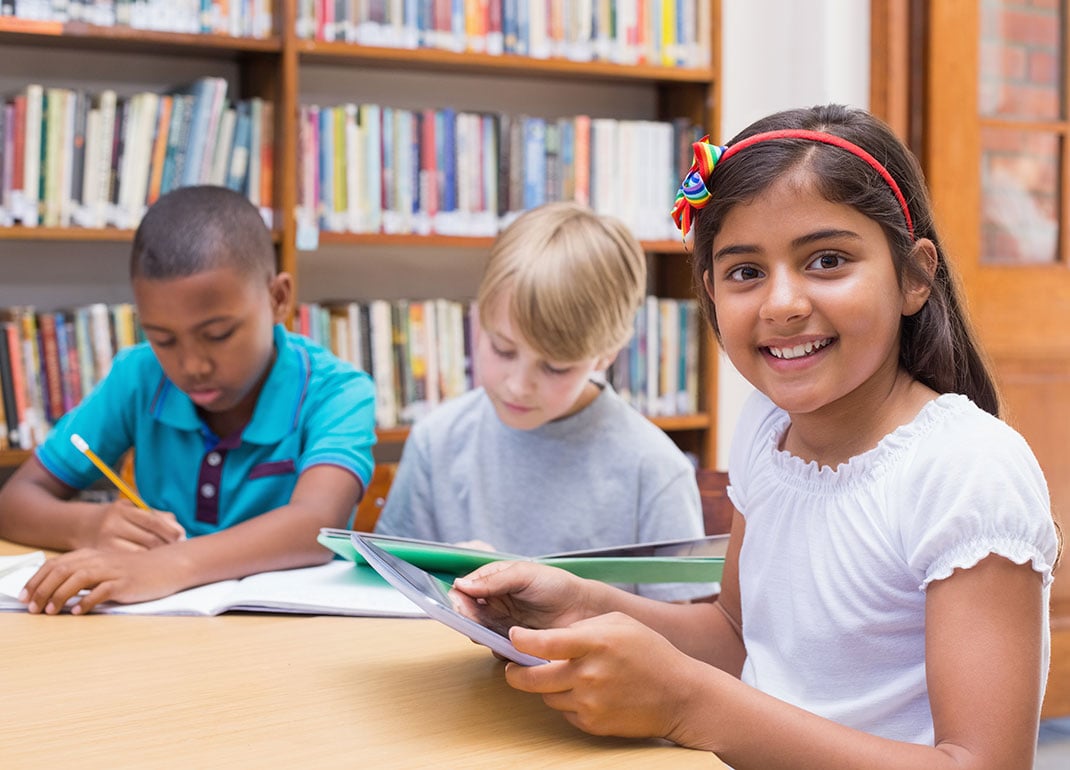 student-with-tablet-plus-books student-with-tablet-plus-books
