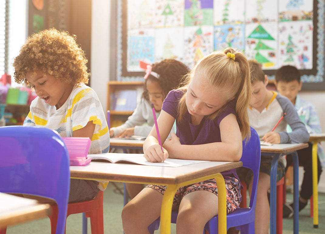 students-in-classroom-writing students-in-classroom-writing