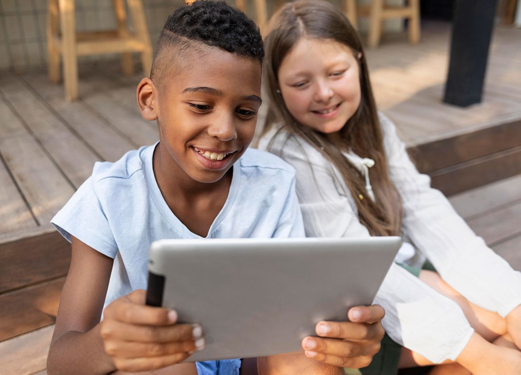 students-looking-at-tablet students-looking-at-tablet